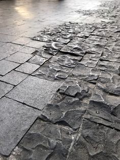 the pavement is covered with cracks and rocks