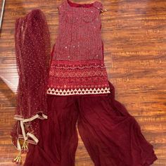 Heavy Work With Dupatta And Palazzo/Flared Pants Best Fit For Size Small 34 Traditional Red Pants For Festive Occasions, Traditional Red Festive Pants, Red Fitted Wide Leg Set, Fitted Red Bottoms For Festivals, Fitted Red Bottoms For Festive Occasions, Festive Fitted Red Pants, Festive Fitted Red Bottoms, Elegant Red Bottoms For Festive Season, Festive Red Bottoms For Festivals