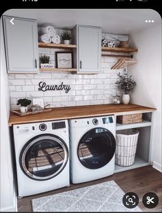 a washer and dryer in a small room with white tile on the walls