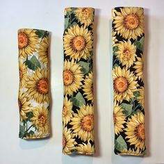 Get into a sunny fall mood with our cheerful sunflower seatbelt covers and backpack strap pads!  Each cover has your choice of blooming sunflowers heads on their stalks on your choice of black or off white background.   Having trouble getting comfortable in your car?  Do your seat belts dig into your shoulder or mash your underwire?  This padded car seatbelt cover is for you!   Sunflowers not your thing?  Choose from tulips, gingko biloba, wisteria, roses, wildflowers, and sunflowers.  Hummingbirds on flower vines are also available in a variety of colors, including white, black, gray, purple, green and rainbow!  Prefer foliage?  Choose from earth tone fall leaves, festive glitter leaves, cotton batik green leaves, or robins with oak leaves.  They are perfect gifts for birdwatchers and gar Car Seatbelt Cover, Seatbelt Cover, Gingko Biloba, Sunflower Head, Flower Vines, Glitter Leaves, Fall Mood, Stroller Straps, Seat Belts