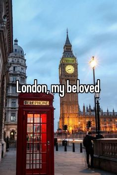 the big ben clock tower towering over london, my beloved red phone booth is in the foreground