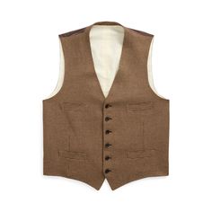 This vest is hand-tailored in Italy from a luxuriously lightweight cloth that was custom-developed for Ralph Lauren with Ireland’s Magee 1866. Its iconic houndstooth pattern is rendered using a blend of fine wool mulberry silk and cashmere. Classic Ralph Lauren Wool Tweed Jacket, Classic Fitted Ralph Lauren Tweed Jacket, Fitted Ralph Lauren Tweed Jacket For Formal Occasions, Formal Fitted Ralph Lauren Tweed Jacket, Ralph Lauren Fitted Tweed Jacket For Formal Occasions, Fitted Herringbone Vest For Fall, Elegant Tweed Workwear Vest, Elegant Tweed Work Vest, Elegant Tweed Business Vest