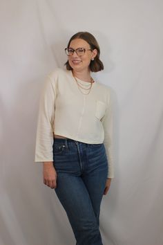 Everyday and simple cream ribbed knit top with long sleeves, cropped fit, and front pocket details details & fit: fits true to size. 64% cotton, 30% polyester, 6% spandex measurements: small: bust 36"/ waist 36"/ length 17.5" medium: bust 38"/ waist 38"/ length 18" large: bust 40"/ waist 40"/ length 18.5" model details: model is 5'7" and wearing size small Top With Long Sleeves, Easy Outfit, Ribbed Knit Top, Large Bust, Pocket Detail, Small Bust, Get Dressed, Simple Outfits, Sales Gifts