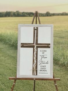 an easel with a cross painted on it