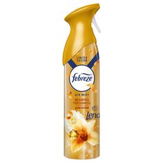 a bottle of deodorant spray on a white background with yellow flowers in it