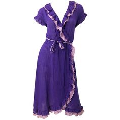 Amazing 1970s purple and lavender lightweight cotton voile short sleeve wrap dress ! Features a vibrant regal purple with lavender ruffle details. Elastic waistband. Both colors on each of the belts. Light and breezy perfect for any time of year. Perfect with sandals, wedges or flats for day wear, and heels or boots for evening. In great condition. Made in USA Approximately Size Medium Measurements: ( lots of stretch ) 34-40 inches bust 25-34 inch waist ( elastic waistband ) Up to 48 inch hips 4 Purple Eccentric Dress, Luxury Purple Cotton Dress, Luxury Vintage Purple Dress, Purple Short Sleeve Cocktail Dress, 70s Wrap Dress, 70s Fashion Dresses, Black Velvet Cocktail, Chiffon Cocktail Dress, Velvet Cocktail Dress