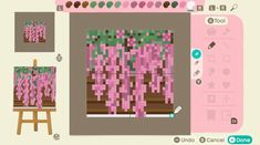 a computer screen with pink flowers on it and an easel in the foreground