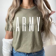 Army wife sweatshirt/crewneck! This will be perfect for engagement gift/Deployment Gifts/graduation gift, holiday gift, etc... This classic unisex jersey short sleeve tee fits like a well-loved favorite. Soft cotton and quality print make users fall in love with it over and over again. These t-shirts have-ribbed knit collars to bolster shaping. The shoulders have taping for better fit over time. Dual side seams hold the garment's shape for longer.  .: 100% Airlume combed and ringspun cotton (fib Army Graduation Outfit, Army Graduation Gifts, Army Wife Tattoos, Army Wife Shirts, Army Sister Shirts, Army Wife Tshirt, Funny Army Wife Meme, Army Mom Shirts, Homemade Shirts