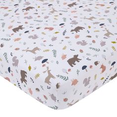 a white sheet with animals and leaves printed on the sheets, it is also available in various colors