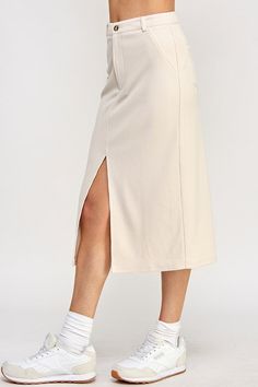 Soft, stretchy, corduroy midi skirt with front split, button and zipper, beltloops, and slant pockets. Fall Cotton Midi Bottoms, Casual Stretch Skirt With Split Hem, Casual Knee-length Skirt With Side Slits, Casual Knee-length Bottoms With Side Slits, Trendy Cotton Midi-length Bottoms, Trendy Midi Length Cotton Bottoms, Trendy Midi-length Cotton Bottoms, Trendy Cotton Midi Bottoms, Spring Workwear Bottoms With Split Hem