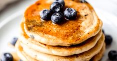 a stack of pancakes with blueberries on top