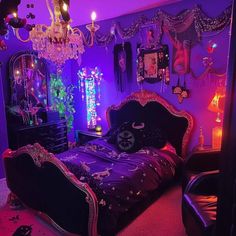 a bedroom decorated in purple and black with chandelier