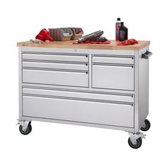 a tool cabinet with drawers and tools on top