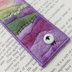 a close up of a bookmark on top of an open book