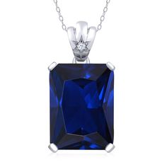 PRICES MAY VARY. Captivating Blue Created Sapphire: This pendant necklace features a stunning 18x13mm emerald-cut blue created sapphire, radiating a mesmerizing deep blue hue that symbolizes wisdom and beauty. It is a true centerpiece that captures attention and creates a lasting impression. Brilliant White Topaz Accents: The blue created sapphire is beautifully complemented by sparkling white topaz accents, adding a touch of elegance and enhancing the overall brilliance of the necklace. Superio Ruby Necklace Pendant, Sapphire Necklace Pendants, Topaz Pendant, Sapphire Pendant, Gem Stone, Fashion Jewelry Necklaces, White Topaz, Necklace For Women, Emerald Cut