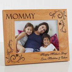 a wooden frame with the words mommy and two children