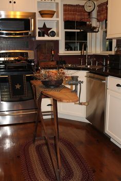 a kitchen with an oven, dishwasher and stove in it's center