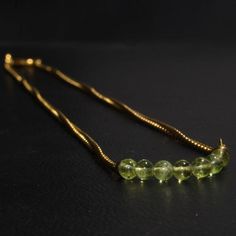 --------- Description -------Material:Silver - Choker Necklace- Green Peridot Choker Necklace -Sterling Silver Necklace - 14K Gold Filled NecklaceBeads Details: 4 to 4 MMBalls Size ; 2 Inch Use Green PeridotShape:BallsCertificate: $10 ExtraOTHER INFORMATIONTreatment :NaturalType: Green Peridot BallsQuantity: 1Quality Grade: AAAQuality :See  PicturesColor: Green----------------------------------------------------------------------------------------------------------------------------------------- Elegant Peridot Round Beads Jewelry, Gold Necklace With Peridot For Formal Occasions, Gold Peridot Necklace For Formal Occasions, Silver Choker Necklace, Peridot Necklace, Gold Filled Necklace, Necklace Beads, Silver Choker, Necklace Green