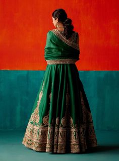 Dazzle in this dark green lehenga set, adorned with intricate embroidery highlighted by various embellishments. Paired elegantly with an embroidered dupatta, this ensemble is designed to make you stand out with its exquisite detailing and rich color, perfect for making a statement at special events. Dark Green Lehenga, Haldi Outfit For Bride, Engagement Lehenga, Indian Bride Outfits, Dark Green Dress, Green Lehenga, Fashion Capsule Wardrobe, Embroidered Lehenga, Indian Bridal Outfits