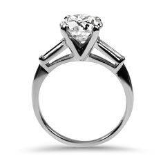 a diamond ring with three baguets on the side