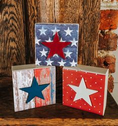 three wooden blocks with stars painted on them