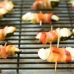 several skewers of food are being cooked on a grill