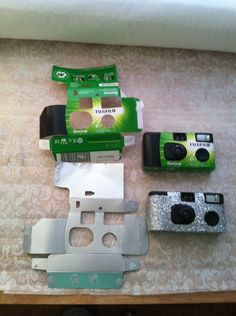 the contents of a camera sitting on top of a table next to a box and other items