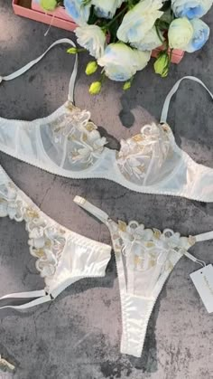 Discover elegance in our white silk base lingerie with delicate gold floral embroidery. Seamlessly blending comfort and luxury, this unique design adds a touch of golden splendor to your wardrobe. Shop now for the perfect fusion of pure white and radiant gold blooms. 💙🌺 SKU:MMZ831-WHITE PRICE: 43.99 Gold Lingerie, Embroidered Bra, Cute Sleepwear, Midnight Garden, Cute Lingerie, Gold Thread, Bra Panty, Gold Threads, Cup Design