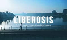 a person standing on a bridge with the words liberosis above it and an image of a lake in the background