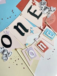 a close up of some type of happy birthday sign on a table with confetti