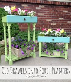 old drawers into porch planters are painted green and blue with flowers growing in them