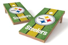 two cornhole game boards with the pittsburgh football team on them