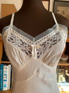 Women’s blue, slip. Very Good condition, size M (6 - 8). Detailed measurements: Bust - 36 inches Waist - 28 inches Vintage Summer Sleepwear With Delicate Lace, Lace Slip With Built-in Bra, Summer V-neck Slip With Lace Trim, Vintage V-neck Slip Dress With Lace Trim, Vintage V-neck Lace Trim Slip Dress, Vintage Slips, Camisole Top, Mesh, Slip On