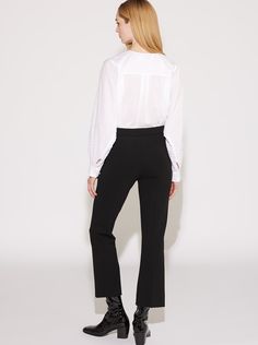 Crafted from a compact stretch crepe knit jersey, the Lola is a modern update on a classic, flared trouser. High rise with a flat waistband at the natural waist, this slim fitting style is flared from the knee to the cropped hem. The Lola also features a stitched crease down the front to further elongate the flattering silhouette. The fabric has a uniquely matte and compact finish that gives it remarkable stretch to maintain shape, comfort, and unlimited movement. It's also FSC® certified respon Black Full-length Pants With Button Closure, Cropped Flares, Stretch Crepe, Flare Trousers, Double Knitting, High Waisted Pants, Slow Fashion, The Knee, Knit Jersey