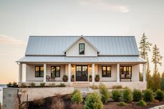 a large white house with a metal roof