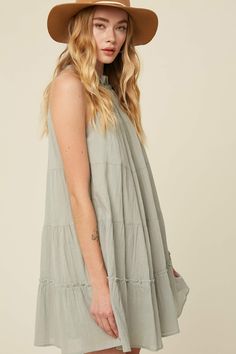 So sweet and effortless! The Maya Halter Mini Dress is sure to be a staple in your warm-weather collection. -Color: Sage -Textured cotton woven fabric -Ruffle halter neck -Keyhole on back with tie strap -Tiered body -Side seam pockets -Lined -Content: 100% cotton -Imported -Model is 5' 10" 33-24-35 and wearing a size Small Halter Neck Mini Dress, Ruffle Tiered Dress, Halter Mini Dress, Neck Ruffle, So Sweet, Halter Neck, Cotton Weaving, Warm Weather, Woven Fabric