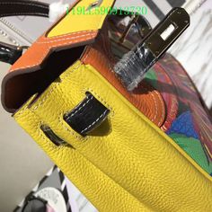 the inside of a yellow handbag with handles