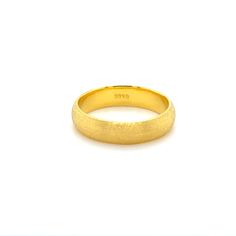 a yellow gold wedding ring on a white background with the word besp written in it