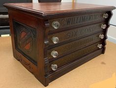 an old wooden chest with writing on it