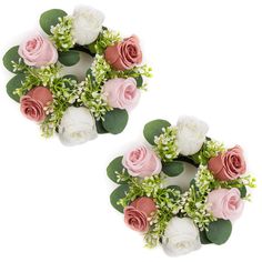 two pink and white flowers with green leaves on each flower headband, one is smaller than the other