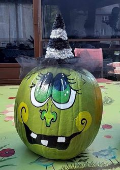 a decorated pumpkin with an angry face on it