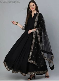 HAND CRAFTED DRESS DESCRIPTION *Black embroidered woven fit and flare dress, has a mandarin collar, three-quarter sleeves, and flared hem *Comes with a matching sequinned dupatta *Size:- Dupatta Length: 2.25 m Dupatta Width: 40 m *Fabric:- Viscose Rayon *Wash Care:- Dry Clean AVAILABLE IN 6 SIZES THEY ARE IN FOLLOWING MEASUREMENTS IN INCHES:- XS:- Bust-34/To Fit Waist-28/Length-54/Hip-38 S:- Bust-36/To Fit Waist-30/Length-54/Hip-40 M:- Bust-38/To Fit Waist-32/Length-54/Hip-42 L:- Bust-40/To Fit Ankle-length Wedding Kurta With Zari Work, Semi-stitched Ankle-length Anarkali Set With Zari Work, Traditional Zari Work Maxi Dress For Diwali, Traditional Maxi Dress With Sheer Dupatta For Navratri, Floor-length Dress With Zari Work For Transitional Season, Transitional Floor-length Dress With Zari Work, Fitted Black Gown With Sheer Dupatta, Black Fitted Gown With Sheer Dupatta, Wedding Maxi Dress Floor-length