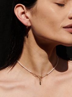 Translated as Bubble in Italian, the Bolla Huggies are little bubbles formed together into a mini hoop that wraps elegantly along the lobe. Perfect for an everyday staple. 14k Gold Bubbled Hollow Hoops 15mm × 11.50 Graduated Shape To 3.5mm Sold as Pair Made in Italy Globally sourced materials Safety Pin Choker, Safety Pins Necklace, Adjustable Metal Choker With Pearl Chain, Metal Pearl Chain Choker, Elegant Yellow Gold Safety Pin Jewelry, Gold Bubbles, Heritage Jewellery, Seed Pearl, Pearl Choker