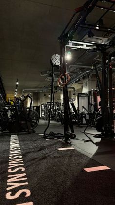 an indoor gym with various machines and equipment