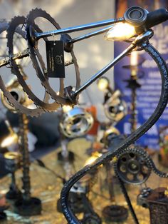 a close up of a metal object with many different types of gears and lights on it