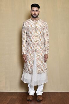 White sherwani with multi colored floral woven motifs. Comes with woven anarkali and churidar. - Aza Fashions Ceremonial Anarkali Sherwani For Festivals, Anarkali Sherwani For Diwali Designer Wear, Designer Anarkali Sherwani For Transitional Season, White Anarkali Bandhgala For Designer Wear, Diwali Anarkali Sherwani With Chikankari Embroidery, Anarkali Style Ceremonial Sherwani With Pallu, Anarkali Sherwani With Pallu For Ceremonial Occasions, Multicolor Designer Sherwani With Traditional Drape, Designer Anarkali White Sherwani