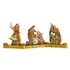 three nativity figurines with gold trimming