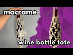 two wine bottles are hanging from macrame