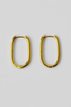 A pair of classic oblong hoop earrings in 18k shiny gold filled brass. Details: Classic oblong link hoop earrings Sold by the pair 20x12x2mm Shiny 18k gold filled brass Made in China Yellow Gold Oblong Earrings For Everyday, Everyday Yellow Gold Oval Link Earrings, Minimalist Oval Hoop Earrings Tarnish Resistant, Minimalist Oval Tarnish Resistant Hoop Earrings, 14k Gold-filled Oval Earrings, Minimalist Tarnish-resistant Oval Hoop Earrings, Minimalist Oval Tarnish-resistant Hoop Earrings, Minimalist 14k Gold Rectangular Hoop Earrings, Everyday Tarnish Resistant Oblong Earrings