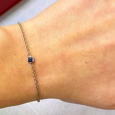 This 14k White Gold Bracelet Features A Delicate Chain With A Bezel Set Round Cut Blue Sapphire Charm. Tiny 15pt Natural Blue Sapphire. September Birthstone. Bracelet Length: Adjustable From 6.25-7.25. We Used The Finest Quality Materials And Utmost Care To Craft This Item And To Ensure Its Brilliance. Comes With Presentable Gift Box. Id: 049427 Elegant Blue Jewelry With Smooth Bezel, Elegant Blue Jewelry With Bezel Setting, Elegant Blue Chain Bracelet As Gift, Elegant Blue Chain Bracelet For Gift, Formal Birthstone Bracelets, Elegant Sapphire Jewelry With Bezel Setting, Formal White Gold Bracelet With Birthstone, Formal Sapphire Diamond Bracelet, Formal White Gold Birthstone Bracelet